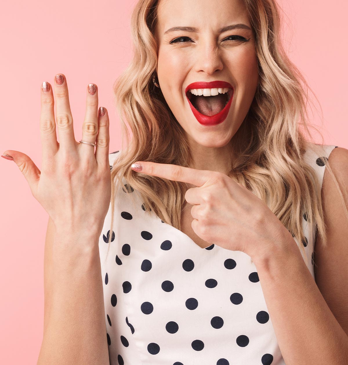 Woman excitedly showing off her engagement ring - Snappy Photobooths engagement celebration