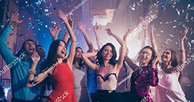 Group of friends celebrating with confetti at a party - Snappy Photobooths